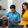 Technician repairing microwave in nashik at home and customer offering water