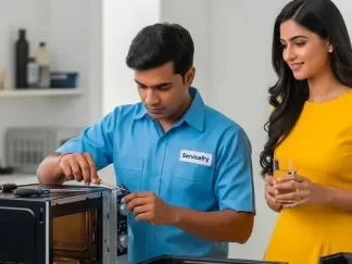Technician repairing microwave in nashik at home and customer offering water