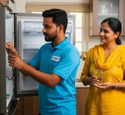 Technician repairing refrigerator in nashik at home and customer offering water