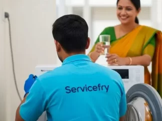 Technician repairing washing machine in nashik at home and customer offering water